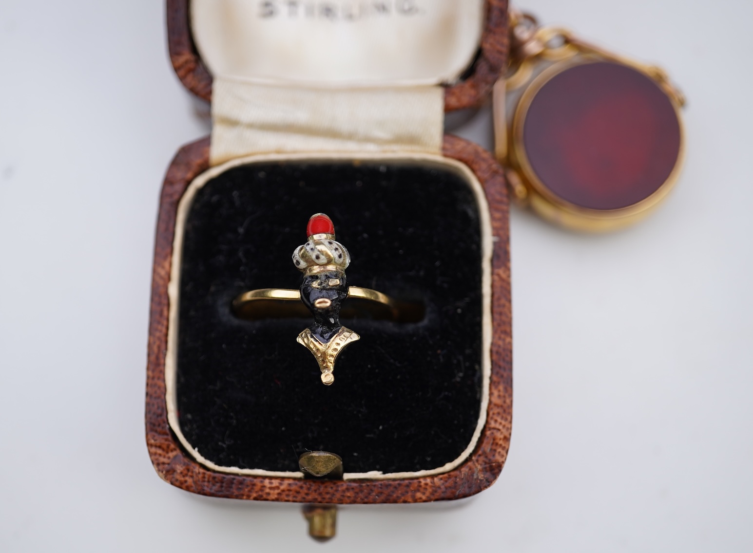 An enamel ring and a hardstone swivel fob seal